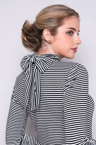Black and white striped turtleneck top with bow