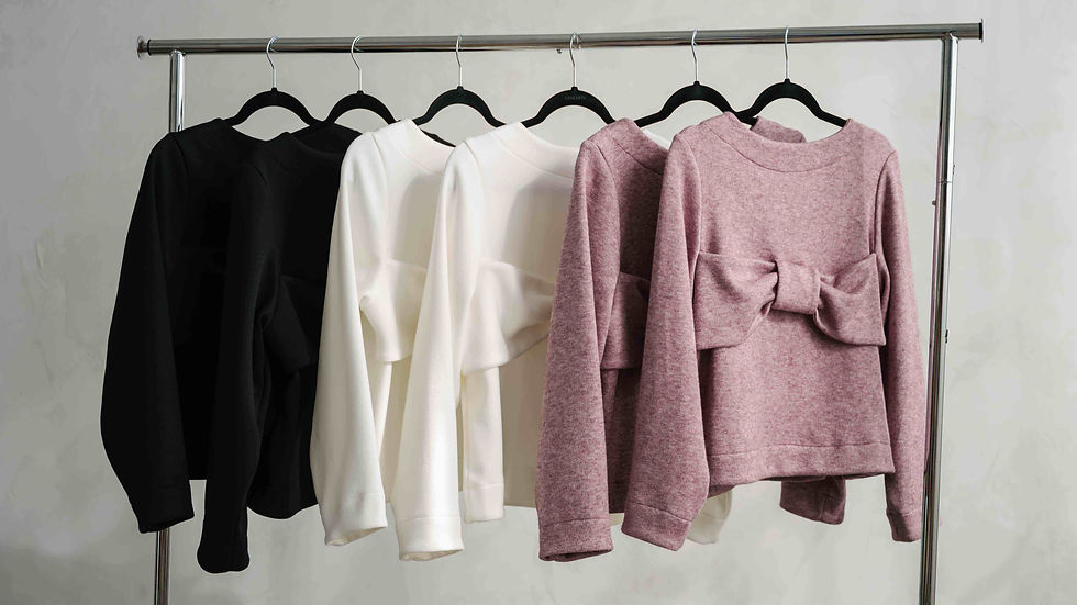 relaxed fit cozy sweater with oversized bow detail