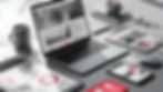 Black and white image of a laptop with an iPad and iPhone with graphs and social media