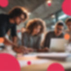 Team working in a marketing agency around a computer