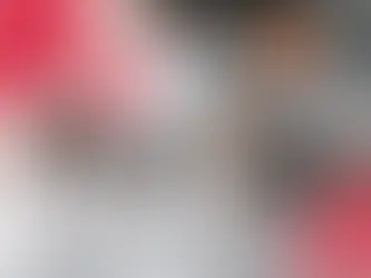 Two coworkers in a meeting discussing business and marketing strategies.