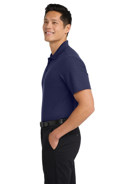 Man wearing Port Authority® Silk Touch™ Performance 1/4-Zip (K584) looking to the side.