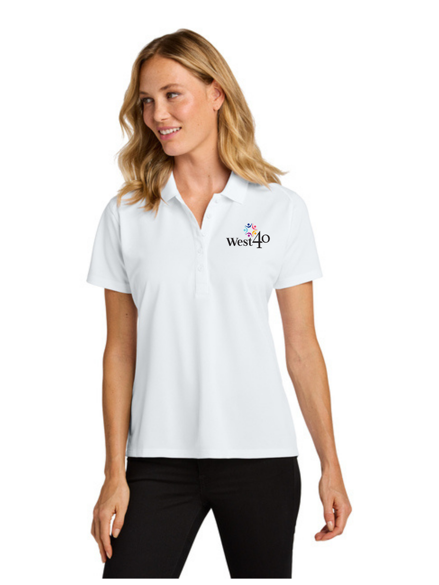 Woman wearing white polo shirt with West40 logo.