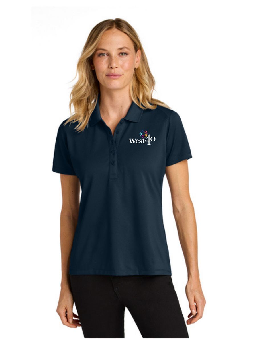 Woman wearing a navy polo shirt with West40 logo. Port Authority® Silk Touch™ Performance 1/4-Zip (K584)