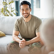 smiling-man-sitting-on-couch-in-casual-setting-2026-03-25-03-09-13-utc.jpg