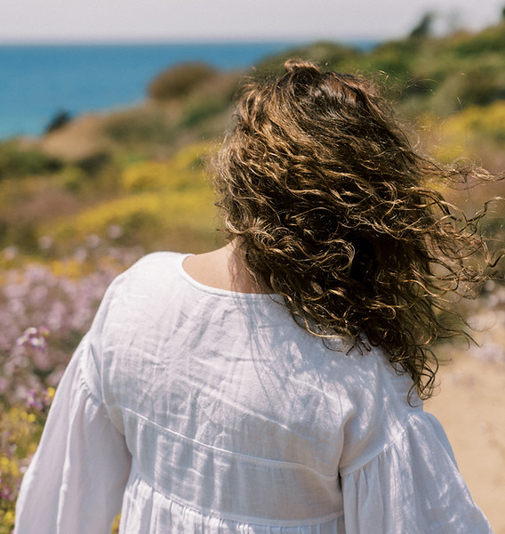 woman with long hair on a beach