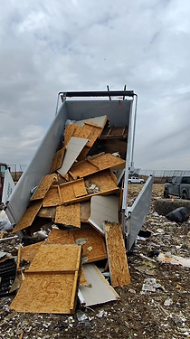Zebra Junk Removal dumping at a landfill