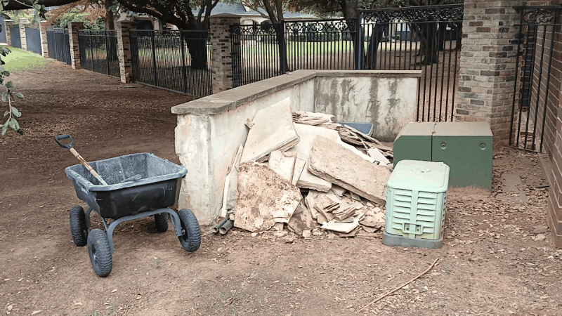 Cleaning up a lot of paver and brick debris from a backyard