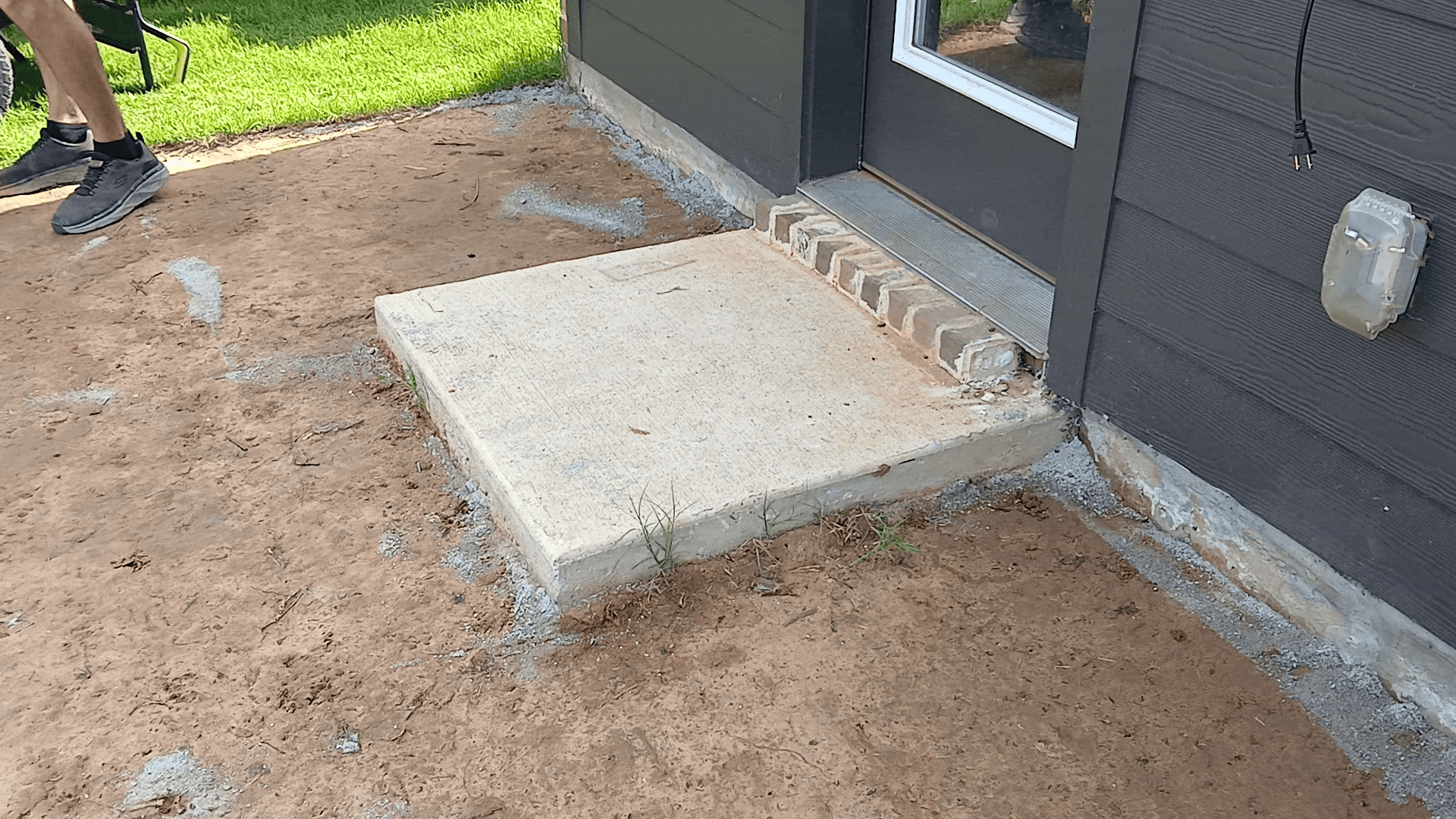 a short gif of a 3 foot by 3 foot concrete landing pad being removed