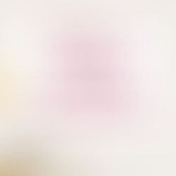 Desk with clock, laptop, and pencil holder with texts: Writer's Toolkits Essentials