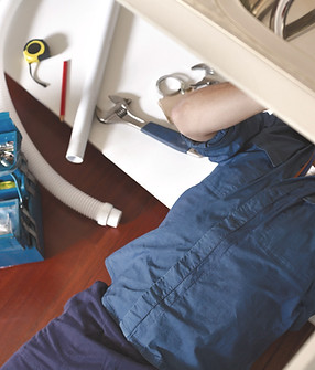 Plumber Fixing Sink