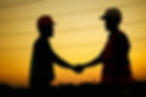 silhouette-of-engineer-and-foreman-shaking-hands-at-construction-site.jpg