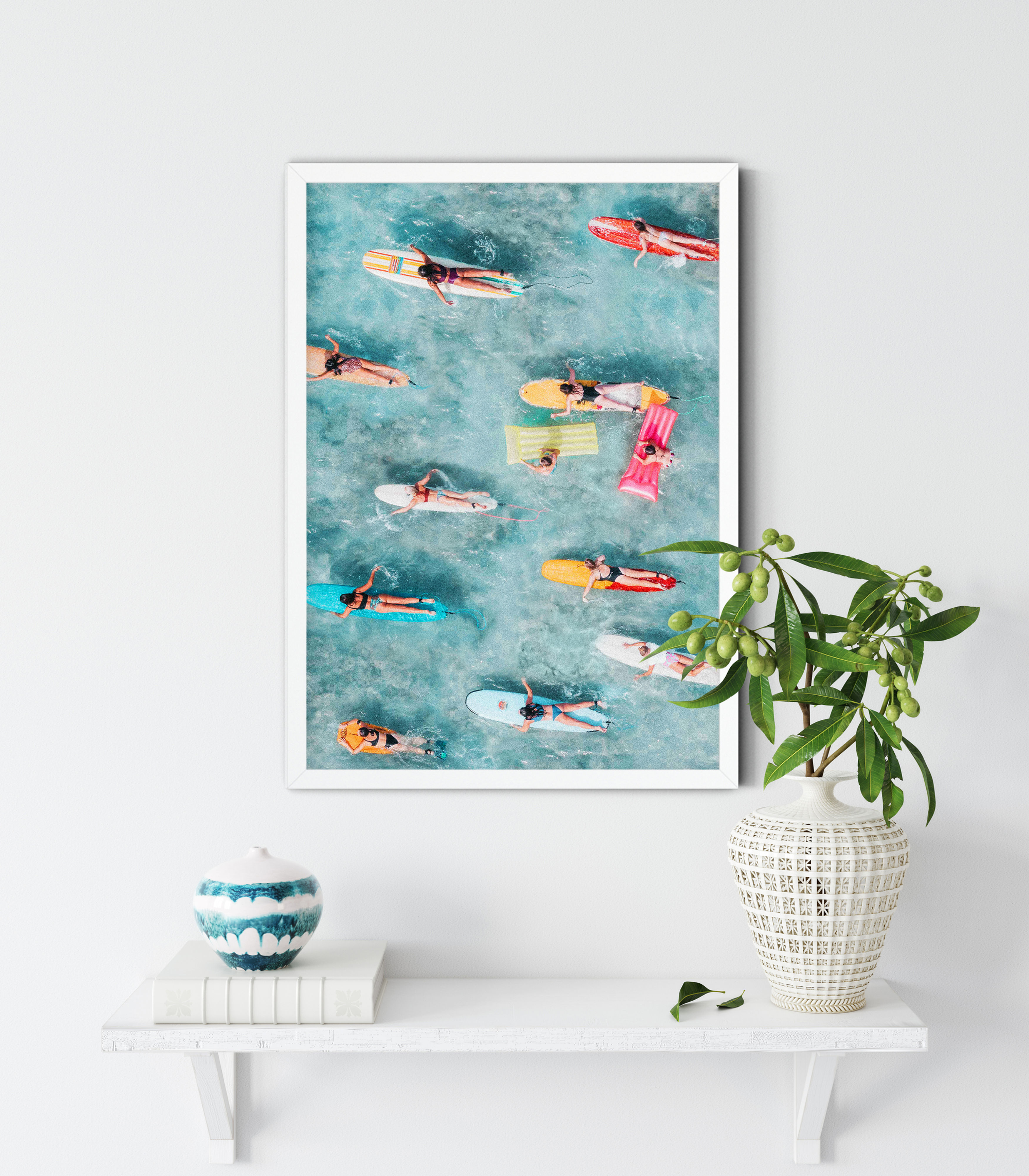 Aerial view of women surfing in the ocean