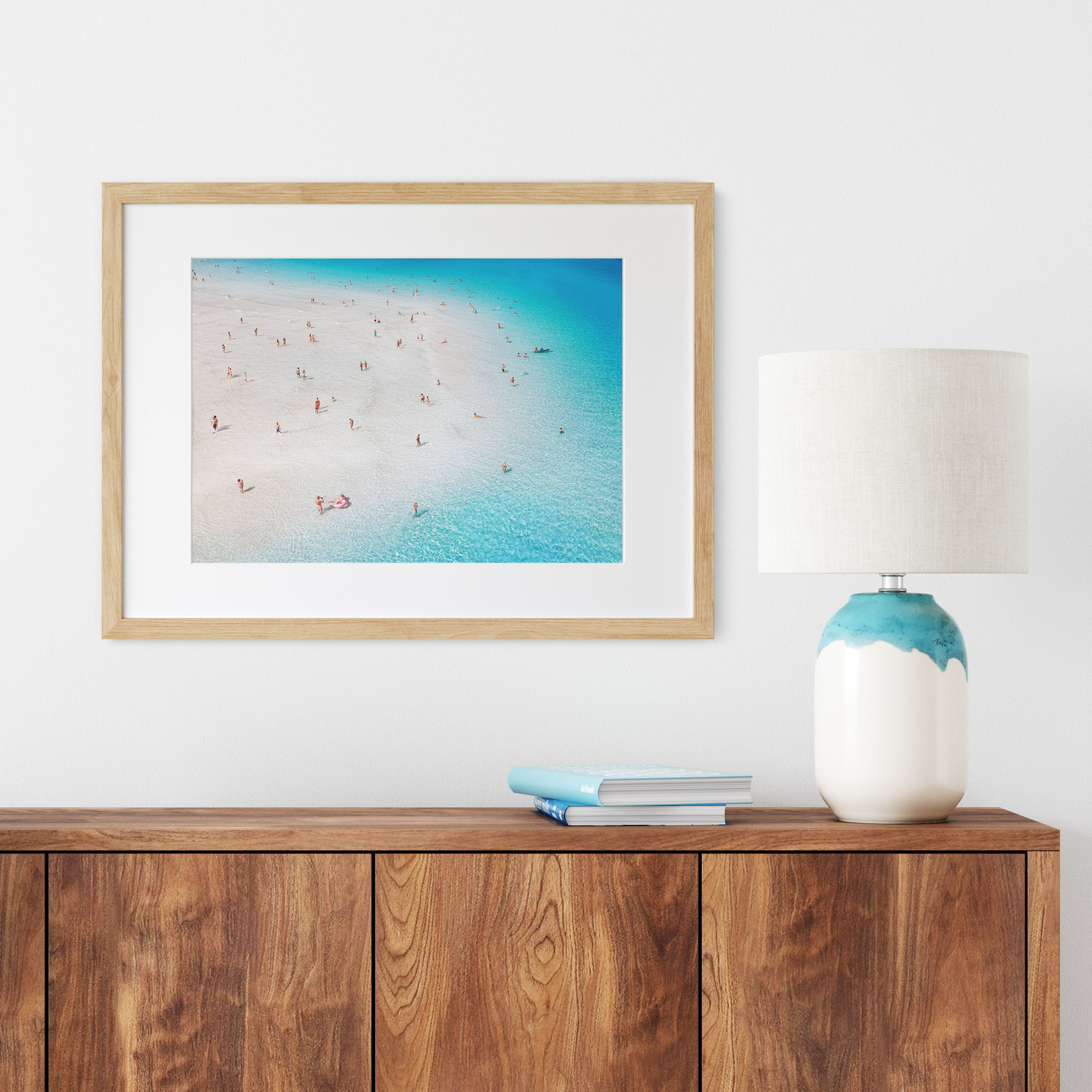 Coastal print featuring transparent water and scattered beachgoers