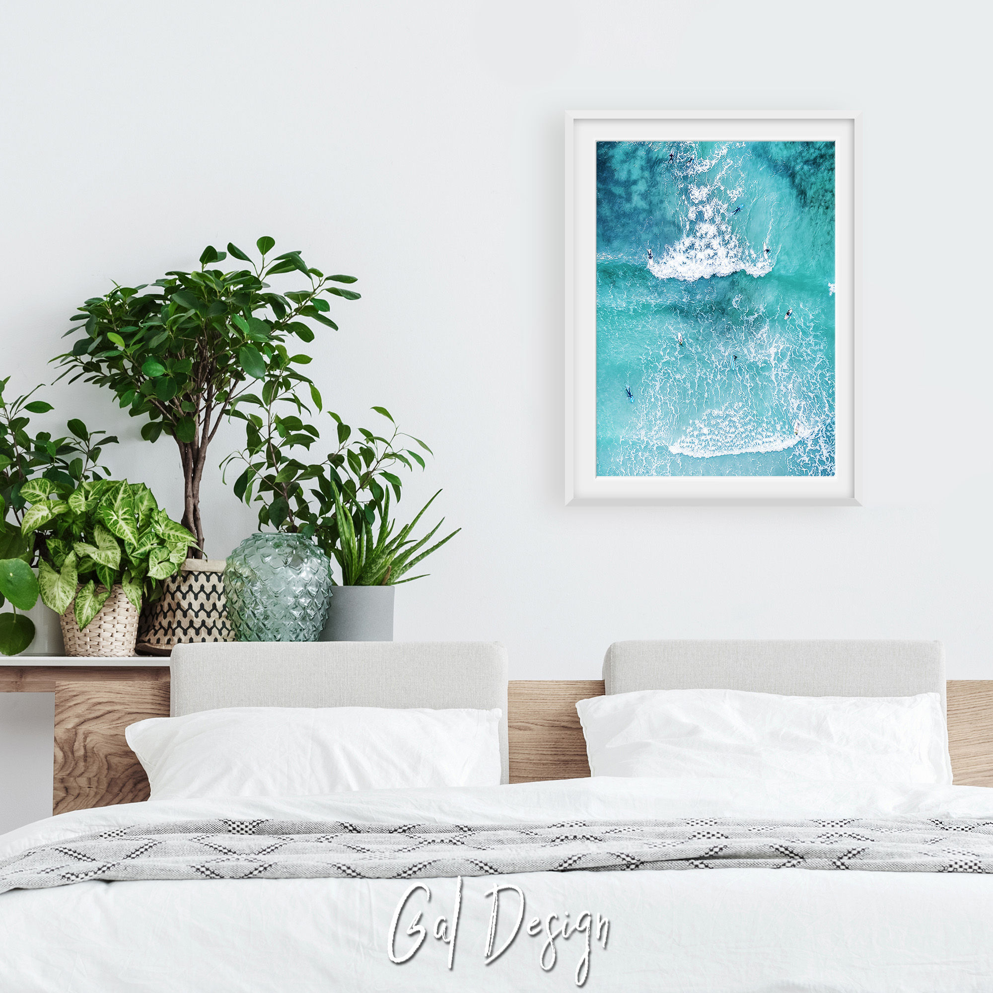 Summer surf scene with blue-green water and small surfer silhouettes