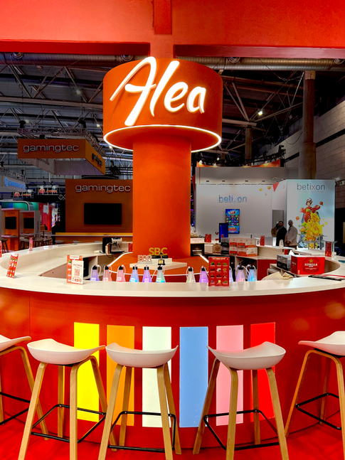 Illuminated central bar inside Alea trade show booth.