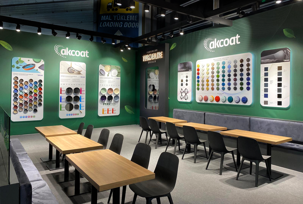 Akcoat stand interior with product display panels, modular seating units that can be joined or divided, and under-seat storage for brochures and materials.