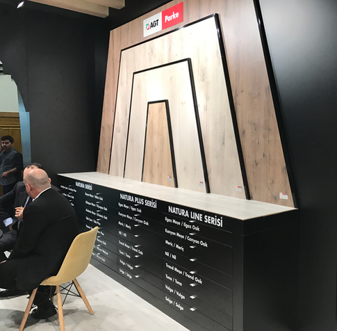 AGT stand showing large panel samples made of their own flooring materials.