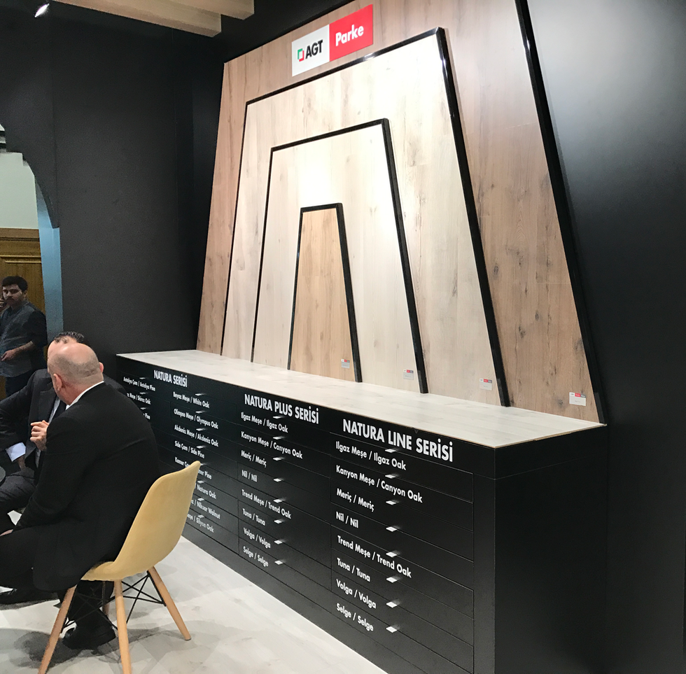 AGT stand showing large panel samples made of their own flooring materials.