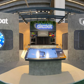 Akcoat exhibition stand with TV Screens and digital touchscreen creating an immersive entrance at Ambiente.