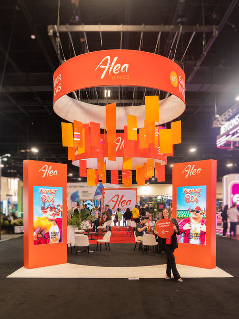 Open booth layout guiding attendees through branded zones and activations.