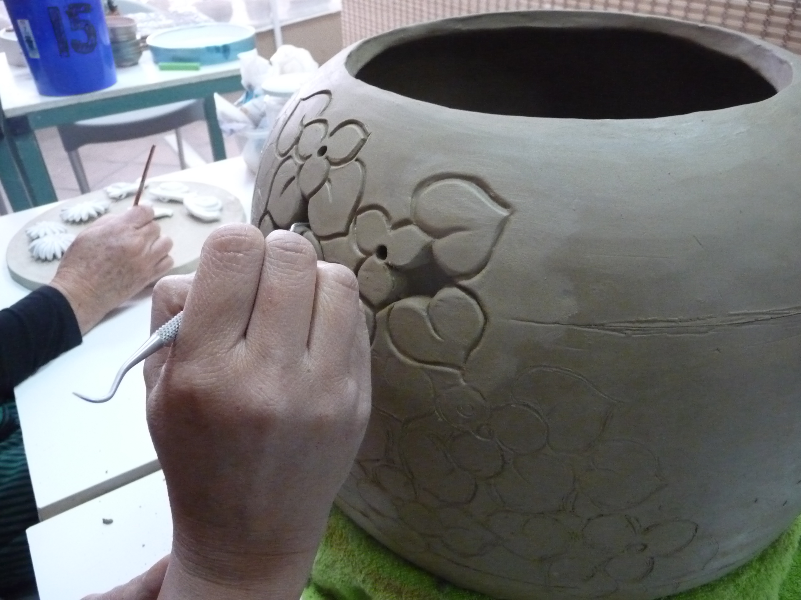 Nor carving her coil pot