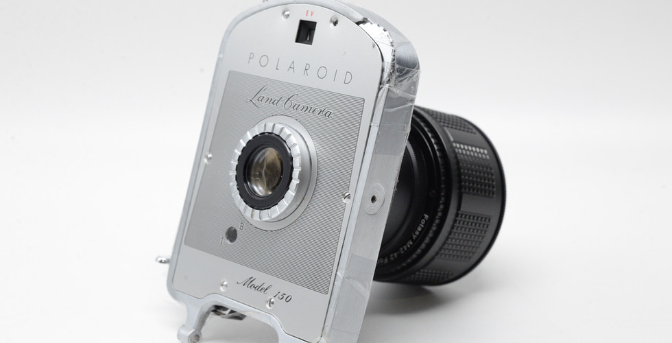 Side View of a Polaroid Land Camera Model 150 Lens 130mm f/8.8