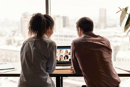 back-view-man-woman-office-having-video-call_edited_edited_edited.jpg