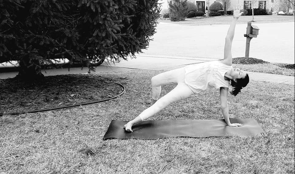 Yoga instructor doing a pose to aid recovery after car crash