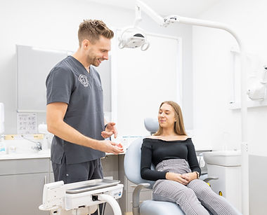 Stephen talking with implant patient