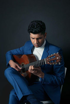 Udit Gupta is a student of Deepak Verma. This picture is about Udit Gupta participating in a Classical Guitar playing competition.