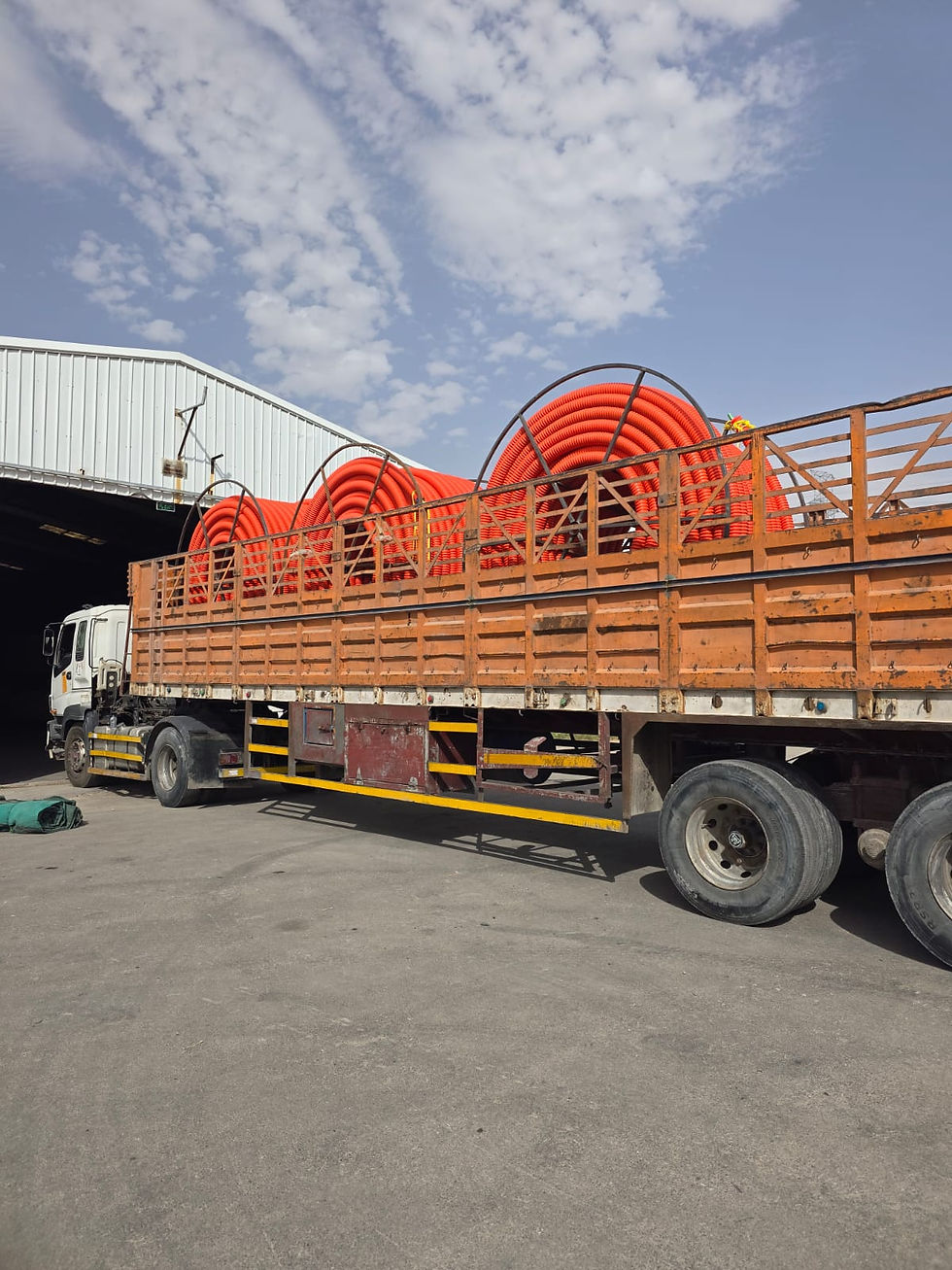 COD pipes being loaded onto trailer for delivery to project site in Saudi Arabia