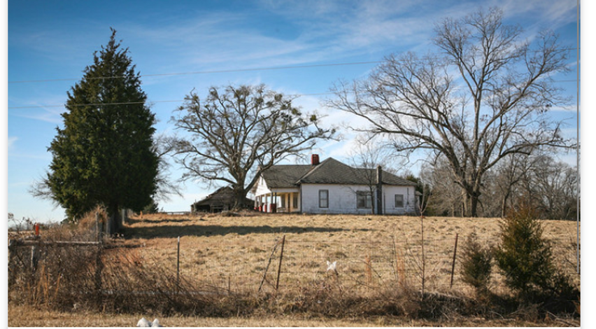 Image of a white home on a hill