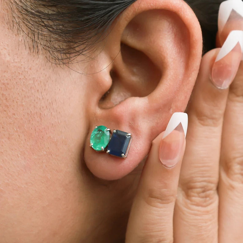 Thumbnail: Emerald & Blue Sapphire Stud Earrings In 14K Yellow Gold Two Stone Stud Earrings