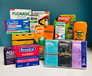 A collection of allergy medications, nasal sprays, eye drops, kleenex and sunscreen showing Columbine Drug offers a range of over the counter medications.