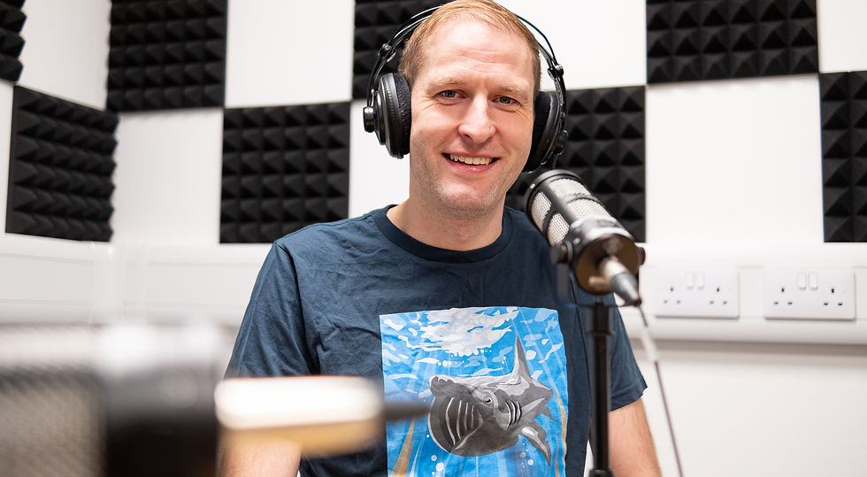 Podcast presenter with headphones on