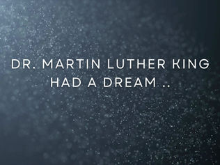 Grey background with white text saying "Dr. Martin Luther King had a dream".