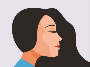 A side profile of a woman with brown hair wearing a blue shirt