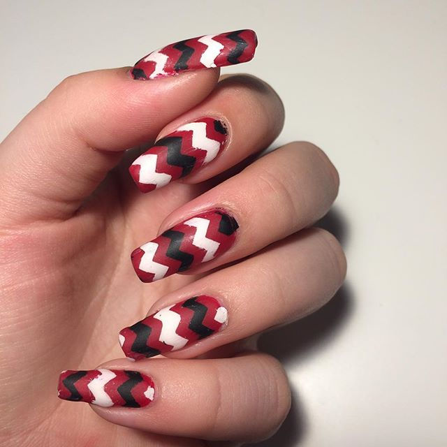 Matte red, white and black chevron nails