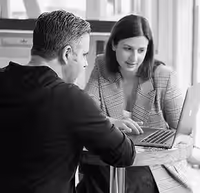 Businessman and businesswoman having a m.avif