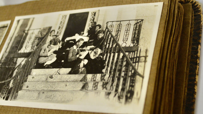 Photograph of the black and white photographs on the brown pages form Mrs Bruce's personal photo album. 