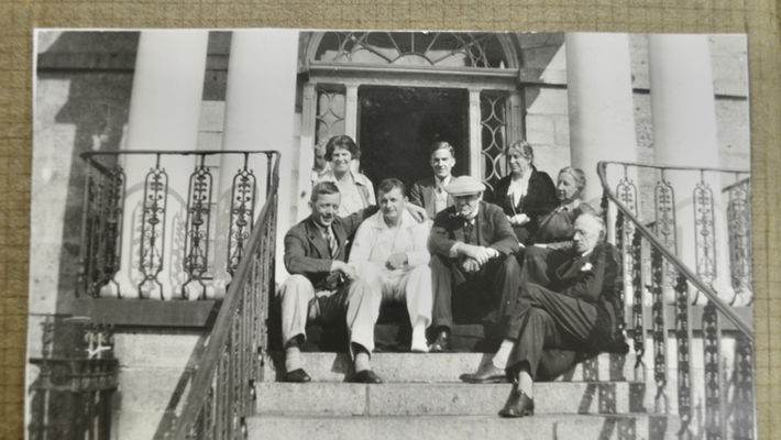 Photograph of the black and white photographs on the brown pages form Mrs Bruce's personal photo album. 