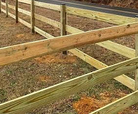 Residential Ranch Rail fence running between yard and country road