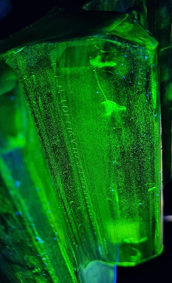A gear wheel viewed under UV lighting