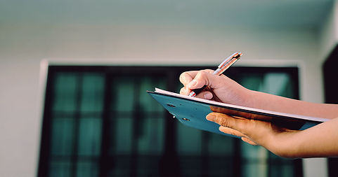 Person holding clipboard.jpg