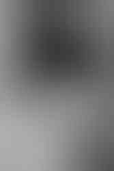 bride embracing groom around neck