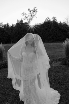 bride under veil for a unique black and white portrait