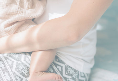 Woman holding your child in her lap