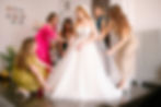 Bridesmaids helping Ellie with her dress in Budapest Hungary