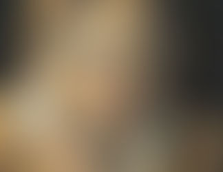 Gros plan sur un portrait funéraire du Fayoum, une peinture réaliste sur bois de l'Égypte romaine représentant le visage d'un homme.